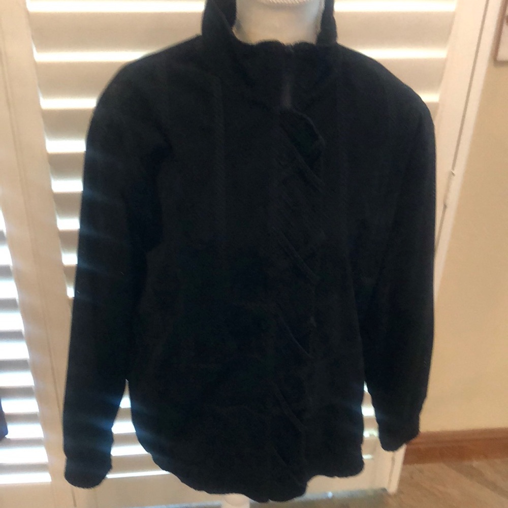 Perlita faux suede bomber style jacket. Soft feel. Body is lined. Zipper front.